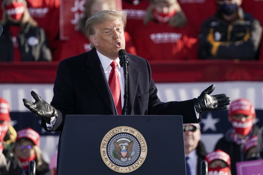 President Donald Trump speaks at a campaign rally Friday, Oct. 30, 2020, at the Austin Straubel Airport in Green Bay, Wis. (AP Photo/Morry Gash)