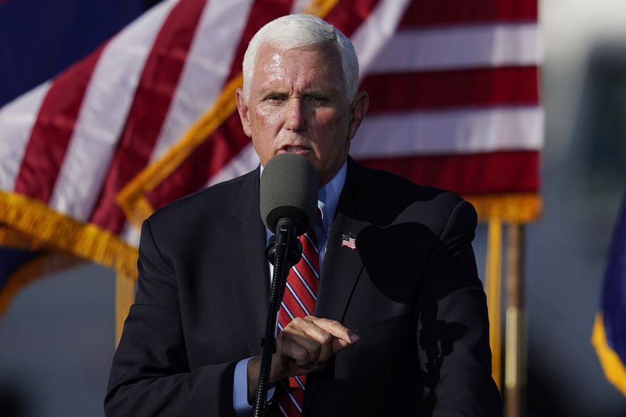 Vice President Mike Pence speaks at a campaign rally at Tucson International Airport Friday, Oct. 30, 2020, in Tucson, Ariz. (AP Photo/Ross D. Franklin)
