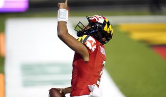 Maryland quarterback Taulia Tagovailoa reacts after scoring a touchdown on a run against Minnesota during the first half of an NCAA college football game, Friday, Oct. 30, 2020, in College Park, Md. (AP Photo/Julio Cortez)