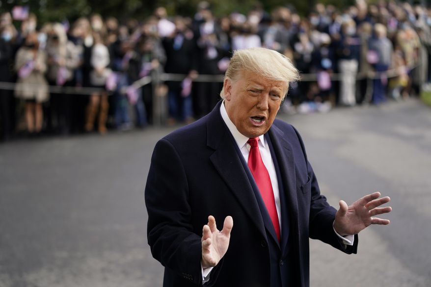 President Donald Trump speaks to members of the press on the South Lawn of the White House in Washington, Friday, Oct. 30, 2020, before boarding Marine One for a short trip to Andrews Air Force Base, Md. Trump is traveling to campaign events in Michigan, Wisconsin and Minnesota. (AP Photo/Patrick Semansky)