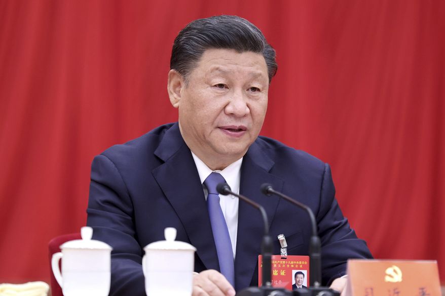 In this photo released by Xinhua News Agency, Chinese President Xi Jinping, also general secretary of the Communist Party of China (CPC) Central Committee, speaks during fifth plenary session of the 19th CPC Central Committee in Beijing on Oct 29, 2020. (Ju Peng/Xinhua via AP)