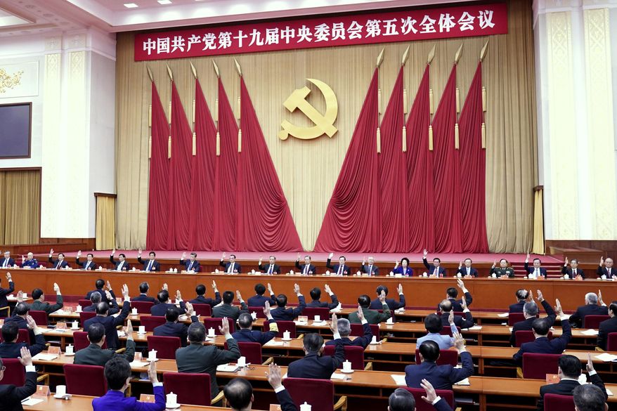 In this photo released by Xinhua News Agency, the Political Bureau of the Communist Party of China (CPC) Central Committee presides over the fifth plenary session of the 19th CPC Central Committee in Beijing, China on Oct 29, 2020. China&#39;s leaders are vowing to make their country a self-reliant &amp;quot;technology power&amp;quot; after a meeting to draft a development blueprint for the state-dominated economy over the next five years. (Yin Bogu/Xinhua via AP)