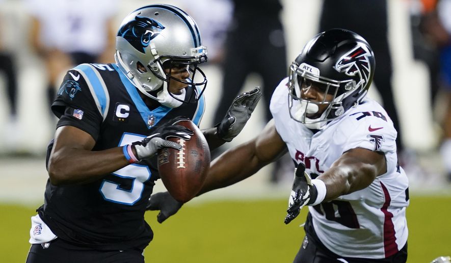 Carolina Panthers quarterback Teddy Bridgewater looks to pass under pressure from Atlanta Falcons defensive end Dante Fowler Jr. during the first half of an NFL football game Thursday, Oct. 29, 2020, in Charlotte, N.C. (AP Photo/Gerry Broome)