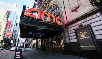 FILE - In this May 13, 2020 file photo, AMC Empire 25 theatre appears on 42nd Street in New York. Last weekend, theaters were cleared to open begin opening in some New York State counties at under 50% capacity and this weekend San Francisco will join in too. New York City and Los Angeles remain closed, however. AMC Theaters and Cinemark are largely up and running. Approximately 54% of screens are open in the U.S., according to the National Association of Theater Owners.  (Photo by Evan Agostini/Invision/AP, File)