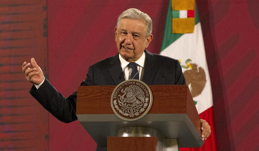 Mexican President Andres Manuel Lopez Obrador gives his daily, morning news conference at the presidential palace, Palacio Nacional, in Mexico City, Friday, Oct. 16, 2020. López Obrador said Friday that his ambassador to the United States told him two weeks ago that there was an investigation underway there involving Mexico&#39;s former defense secretary, retired Gen. Salvador Cienfuegos, who was arrested Thursday in Los Angeles. (AP Photo/Marco Ugarte)