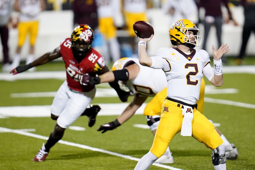 Minnesota quarterback Tanner Morgan attempts a pass against Maryland during the first half of an NCAA college football game, Friday, Oct. 30, 2020, in College Park, Md. (AP Photo/Julio Cortez)