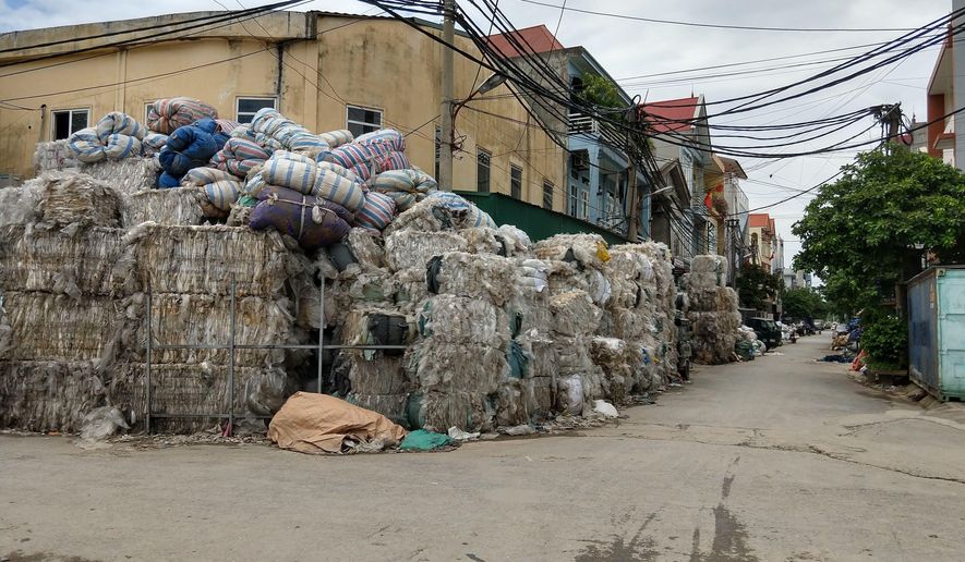 This 2018 file photo provided by researcher Jenna Jambeck shows imported film plastic stored on a street until it can be processed in Southeast Asia. The Pittsburgh City Council voted unanimously on April 12, 2022, to enact legislation to bar grocers and other retailers from distributing single-use plastic bags beginning April 12, 2023. (Jenna Jambeck via AP) **FILE**
