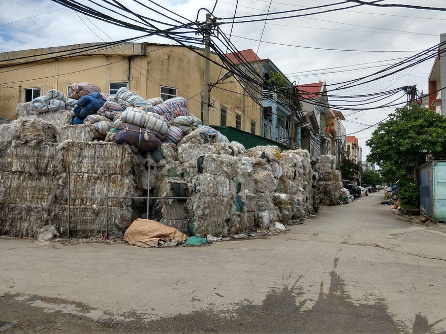 This 2018 file photo provided by researcher Jenna Jambeck shows imported film plastic stored on a street until it can be processed in Southeast Asia. The Pittsburgh City Council voted unanimously on April 12, 2022, to enact legislation to bar grocers and other retailers from distributing single-use plastic bags beginning April 12, 2023. (Jenna Jambeck via AP) **FILE**