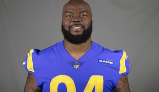 FILE- This is a 2020 file photo of A&#39;Shawn Robinson of the Los Angeles Rams NFL football team. The Rams activated Robinson to their 53-man roster Friday, Oct. 30, 2020, but they haven&#39;t decided whether the hulking defensive tackle will play Sunday at Miami.  (AP Photo/File)