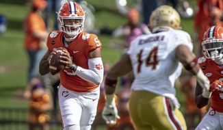 Clemson quarterback D.J. Uiagalelei (5) passes the ball during the first half an NCAA college football game against Boston College on Saturday, Oct. 31, 2020, in Clemson, S.C.  (Josh Morgan/Pool Photo via AP)