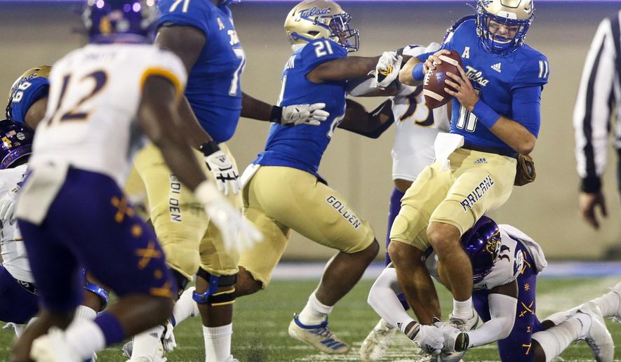 East Carolina defensive back Jireh Wilson (35) sacks Tulsa quarterback Zach Smith (11) during an NCAA college football game Friday, Oct. 30, 2020, in Tulsa, Okla. (Ian Maule/Tulsa World via AP)