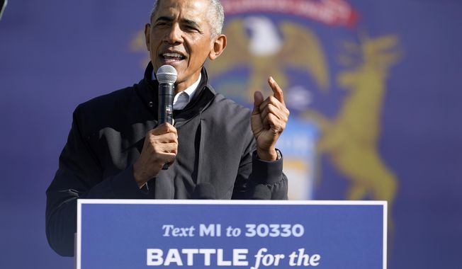 Former President Barack Obama speaks at a rally for Democratic presidential candidate former Vice President Joe Biden, at Northwestern High School in Flint, Mich., Saturday, Oct. 31, 2020. (AP Photo/Andrew Harnik)