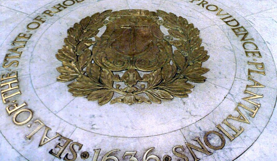 FILE - This Jan. 21, 2000, file photo shows the seal bearing the official name "State of Rhode Island and Providence Plantations" on the floor of the Statehouse rotunda in Providence, R.I. A statewide ballot question in the Nov. 3, 2020, election asks voters whether to shorten the state's official name to drop the plantations reference. (AP Photo/Susan E. Bouchard, File)