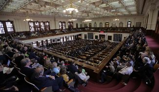 FILE - In this Tuesday, Feb. 5, 2019 file photo, A full gallery oversees the Texas Gov. Greg Abbott giving his State of the State Address in the House Chamber in Austin, Texas. Two years ago, a longtime Republican incumbent held onto his west Houston state House seat by the slimmest of margins, a mere one-tenth of percentage point in a race that helped the GOP withstand a Democratic wave. This year, the stakes are even higher. AP Photo/Eric Gay)