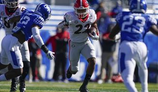 Georgia running back Kendall Milton (22) runs with the ball during the first half of an NCAA college football game against Kentucky, Saturday, Oct. 31, 2020, in Lexington, Ky. (AP Photo/Bryan Woolston)