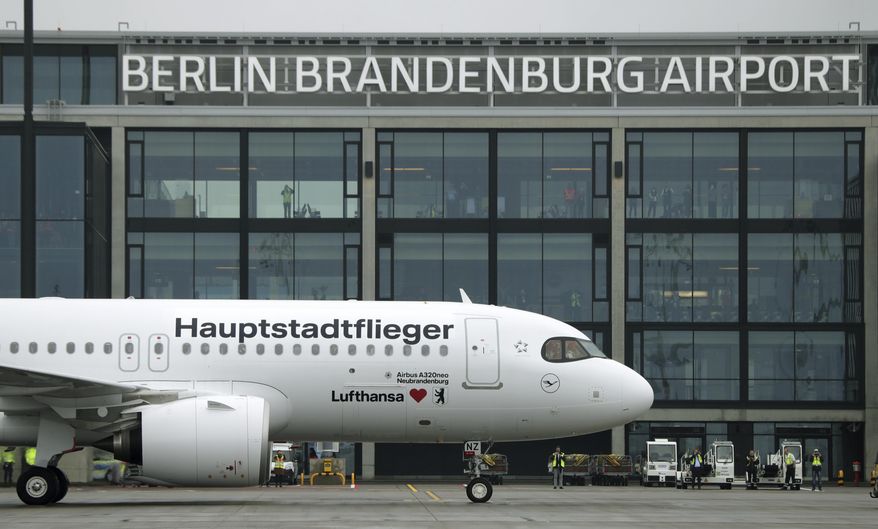 A &#x27;Lufthansa&#x27; ariplane is parked in front of Terminal 1 after its arrival at the new Berlin-Brandenburg-Airport &#x27;Willy Brandt&#x27; in Berlin, Germany, Saturday, Oct. 31, 2020. Berlin&#x27;s new airport opens after years of delays and cost overruns. (AP Photo/Michael Sohn) **FILE**