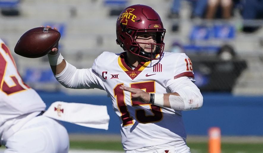 Iowa State quarterback Brock Purdy passes to a teammate during the second half of an NCAA college football game against Kansas in Lawrence, Kan., Saturday, Oct. 31, 2020. Iowa State defeated Kansas 52-22. (AP Photo/Orlin Wagner)