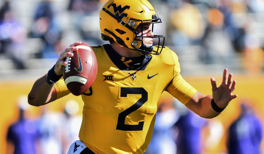 West Virginia quarterback Jarret Doege (2) makes a pass against Kansas State during an NCAA college football game Saturday, Oct. 31, 2020, in Morgantown, W.Va. (William Wotring/The Dominion-Post via AP)