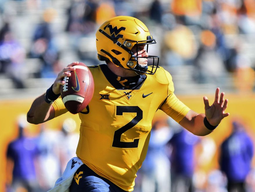 West Virginia quarterback Jarret Doege (2) makes a pass against Kansas State during an NCAA college football game Saturday, Oct. 31, 2020, in Morgantown, W.Va. (William Wotring/The Dominion-Post via AP)