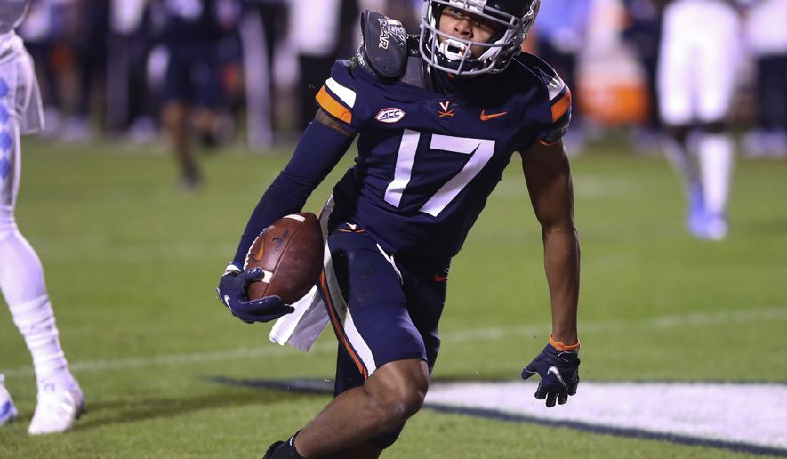 Virginia wide receiver Ra'Shaun Henry (17) scores a touchdown against North Carolina during an NCAA college football game Saturday, Oct. 31, 2020, in Charlottesville, Va. (Andrew Shurtleff/The Daily Progress via AP)