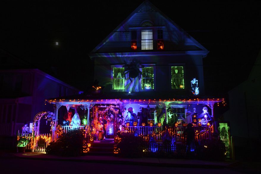 A house along Park Avenue in the Schoentown section of Port Carbon, Pa., is covered in Halloween decorations on Wednesday, Oct. 28, 2020. The backyard is also decorated. (Lindsey Shuey/The Republican-Herald via AP)