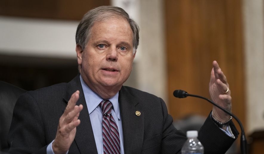 Sen. Doug Jones, D-Ala., questions witnesses during a Senate Senate Health, Education, Labor, and Pensions Committee Hearing on the federal government response to COVID-19 on Capitol Hill Wednesday, Sept. 23, 2020, in Washington. (Alex Edelman/Pool via AP)