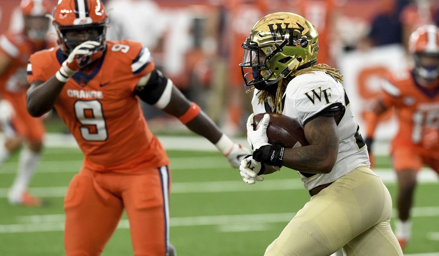 Wake Forest Demon Deacons running back Christian Beal-Smith (26) during the first half of an NCAA college football game against Syracuse on Saturday, Oct. 31, 2020, in Syracuse, N.Y. (Dennis Nett/The Post-Standard via AP)