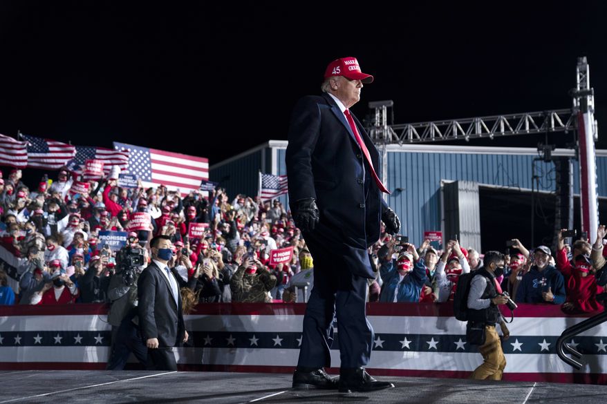 President Donald Trump arrives for a campaign rally at Hickory Regional Airport, Sunday, Nov. 1, 2020, in Hickory, N.C. (AP Photo/Evan Vucci)