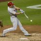 This Sept. 22, 2020, file photo shows Philadelphia Phillies&#39; J.T. Realmuto batting during the second baseball game of a doubleheader against the Washington Nationals in Washington. Houston outfielder George Springer, New York Yankees second baseman DJ LeMahieu and Realmuto were among just six free agents who received $18.9 million qualifying offers on Sunday, Nov. 1, 2020, from their former teams. Three right-handed pitchers also received the offers, Cincinnati’s Trevor Bauer, the New York Mets’ Marcus Stroman, and San Francisco&#39;s Kevin Gausman. (AP Photo/Nick Wass, File)  **FILE**
