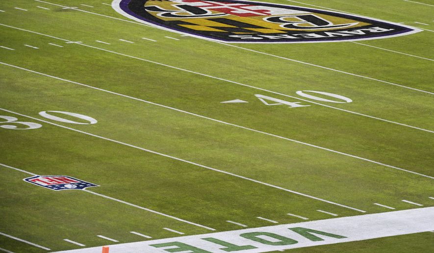 Vote is painted on the sidelines at M&T Bank Stadium before an NFL football game between the Baltimore Ravens and the Pittsburgh Steelers, Sunday, Nov. 1, 2020, in Baltimore. (AP Photo/Terrance Williams)