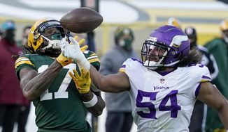 Minnesota Vikings&#39; Eric Kendricks breaks up a pass intended for Green Bay Packers&#39; Davante Adams during the second half of an NFL football game Sunday, Nov. 1, 2020, in Green Bay, Wis. (AP Photo/Morry Gash)