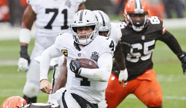 Las Vegas Raiders quarterback Derek Carr (4) rushes during the first half of an NFL football game against the Cleveland Browns, Sunday, Nov. 1, 2020, in Cleveland. (AP Photo/Ron Schwane)