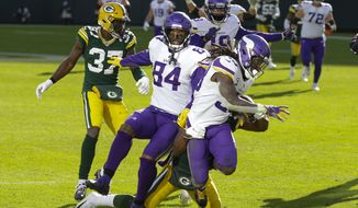 Minnesota Vikings&#39; Dalvin Cook breaks away for a touchdown during the second half of an NFL football game against the Green Bay Packers Sunday, Nov. 1, 2020, in Green Bay, Wis. (AP Photo/Mike Roemer)