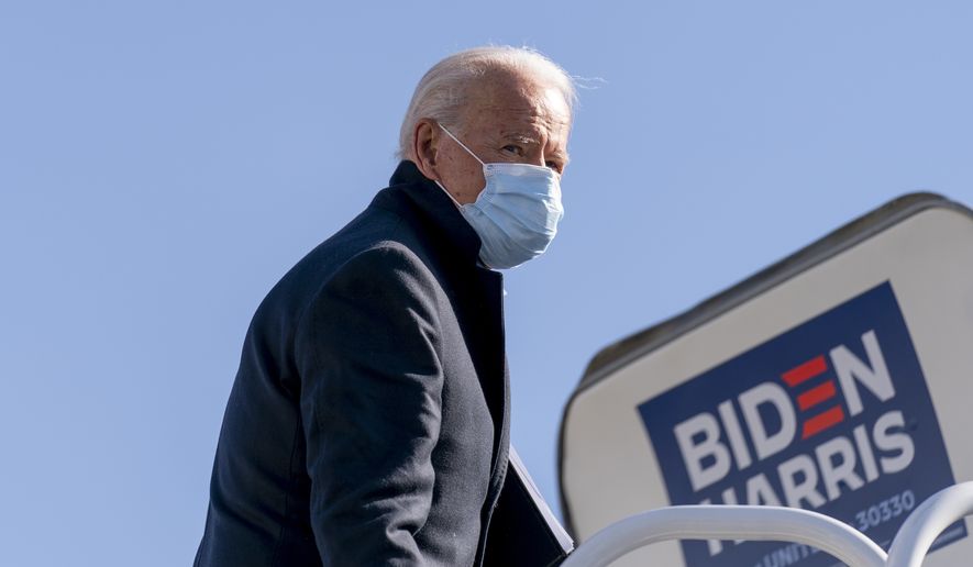 Democratic presidential candidate former Vice President Joe Biden boards his campaign plane in Wilmington, Del., Monday, Nov. 2, 2020, to travel to Cleveland for a rally. Biden is holding rallies in Ohio and Pennsylvania. (AP Photo/Andrew Harnik)