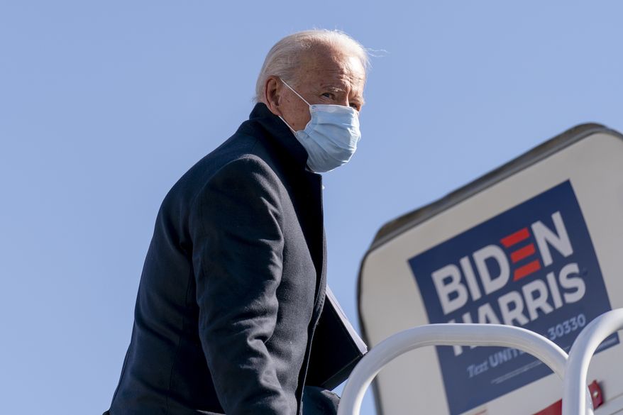 Democratic presidential candidate former Vice President Joe Biden boards his campaign plane in Wilmington, Del., Monday, Nov. 2, 2020, to travel to Cleveland for a rally. Biden is holding rallies in Ohio and Pennsylvania. (AP Photo/Andrew Harnik)