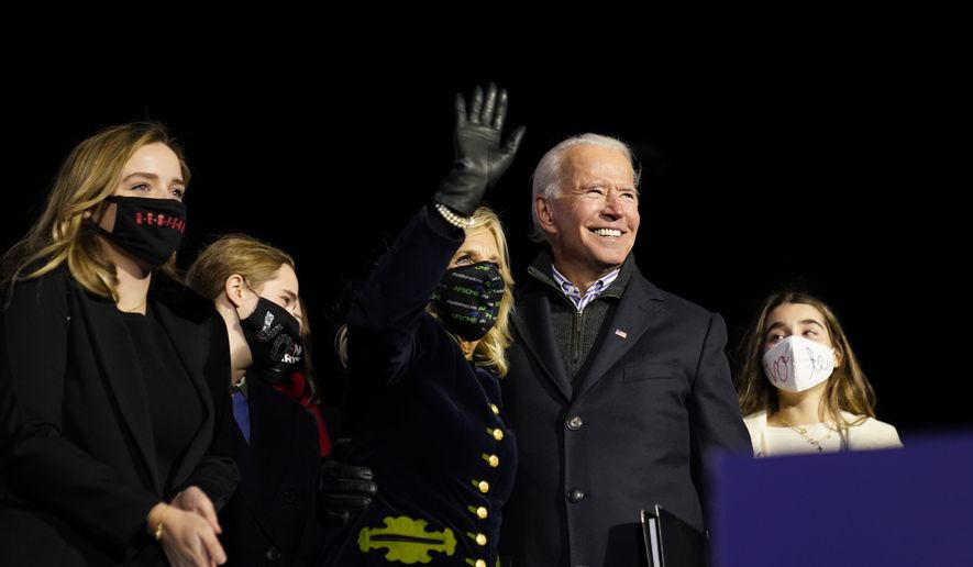 Democratic presidential candidate former Vice President Joe Biden stands with his wife Jill Biden and his grandchildren during a drive-in rally at Heinz Field, Monday, Nov. 2, 2020, in Pittsburgh. (AP Photo/Andrew Harnik)