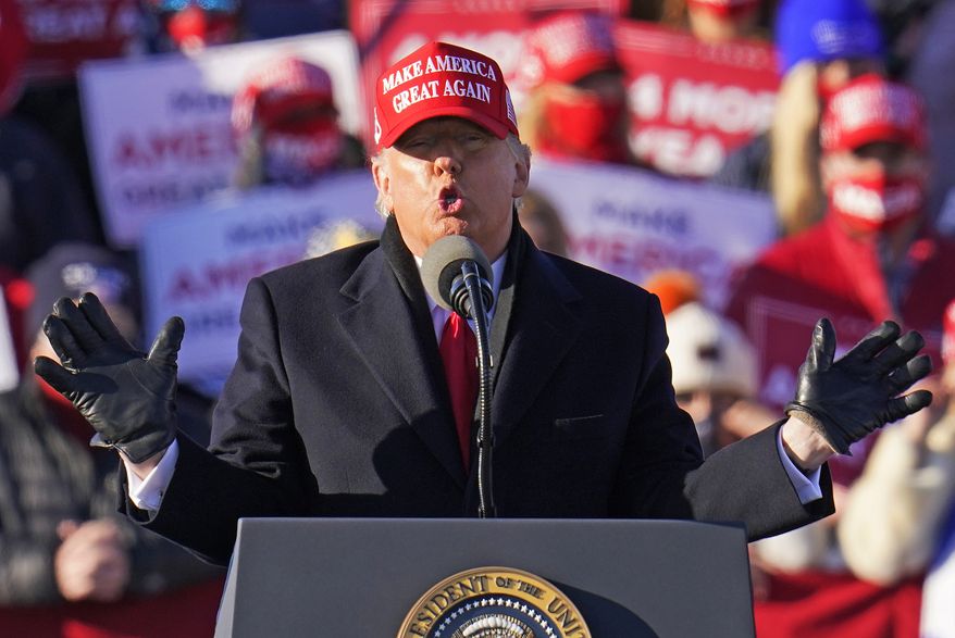 President Donald Trump gestures as he addresses a campaign rally at the Wilkes-Barre Scranton International Airport in Avoca, Pa, Monday, Nov. 2, 2020. (AP Photo/Gene J. Puskar)