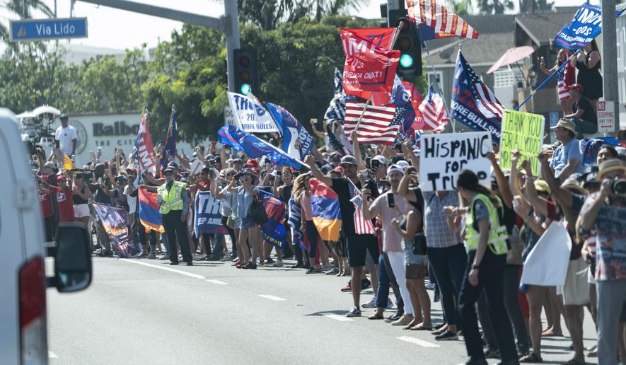 FILE - In this Oct. 18, 2020 file photo supporters line the route for the motorcade of President Donald Trump, in Newport Beach, Calif. The nation's most populous state is known as the home of the so-called Trump resistance, and he lost California by over 4 million votes to Hillary Clinton in the 2016 presidential election. The contest Tuesday, Nov. 3, 2020, will be decided in battlegrounds like Wisconsin and Pennsylvania, the most interesting question in California might be the size of Trump's expected defeat. (AP Photo/Alex Brandon, File)