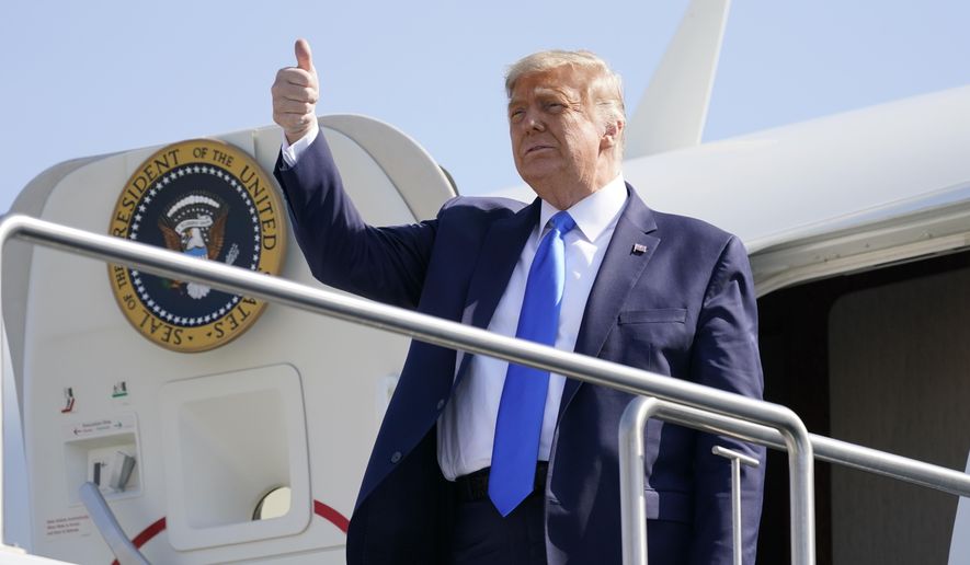 In this Oct. 18, 2020, file photo, President Donald Trump gives a thumbs-up as he steps off Air Force One at John Wayne Airport, in Santa Ana, Calif. (AP Photo/Alex Brandon, File)