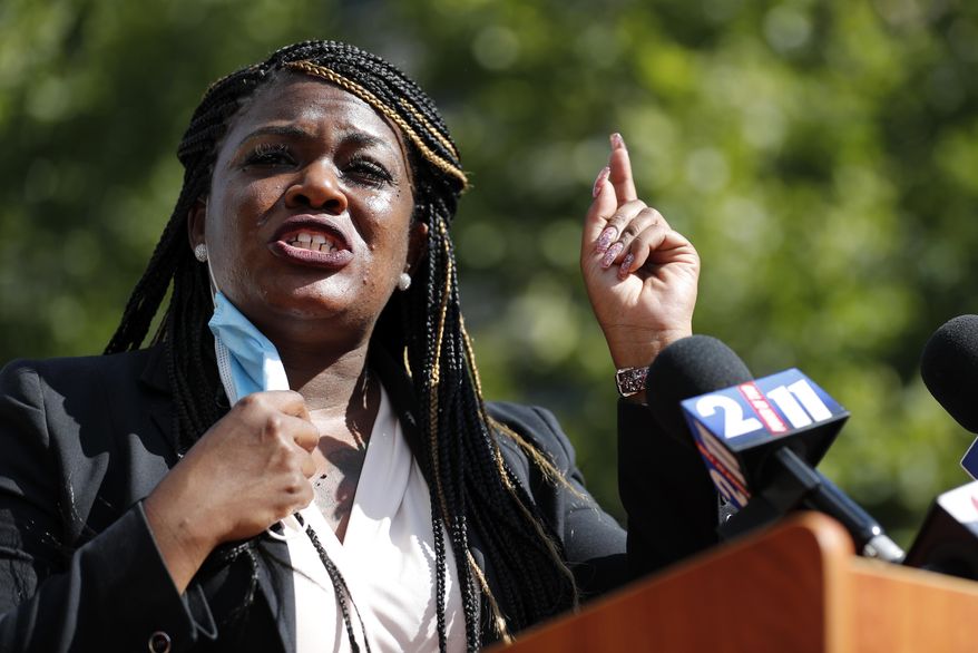 In this Aug. 5, 2020, file photo, Activist Cori Bush speaks during a news conference Wednesday, Aug. 5, 2020, in St. Louis. Bush is a racial justice activist running for Missouri's 1st Congressional seat in the Nov. 3, 2020, general election. (AP Photo/Jeff Roberson, File)