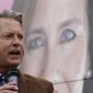FILE - In this Oct. 21, 2020, file photo, U.S. Rep. Roger Marshall, R-Kan., Republican candidate for U.S. Senate, speaks in front of photo of Supreme Court nominee Amy Coney Barrett at a campaign stop in Kansas City, Kan. (AP Photo/Charlie Riedel, File)