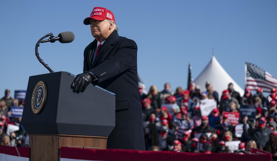 President Donald Trump speaks during a campaign rally at Fayetteville Regional Airport, Monday, Nov. 2, 2020, in Fayetteville, N.C. (AP Photo/Evan Vucci)