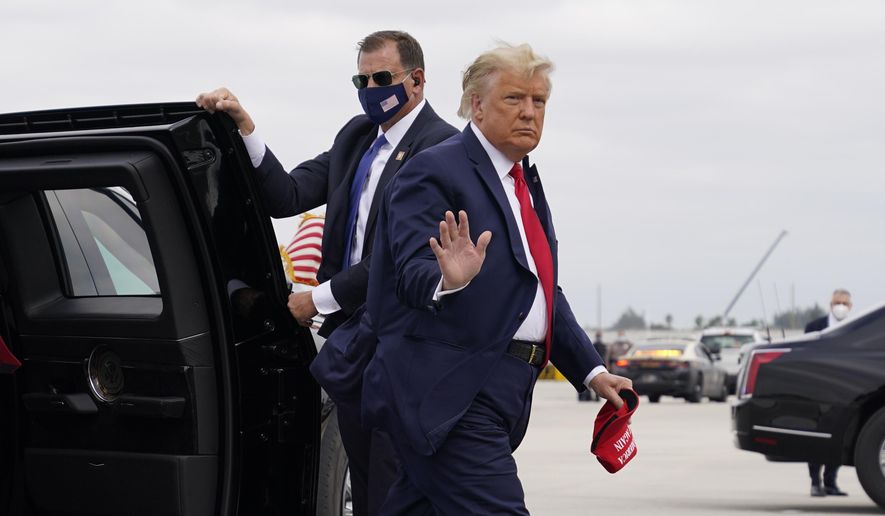 President Donald Trump arrives to board Air Force One for a day of campaign rallies, Monday, Nov. 2, 2020, in Miami. (AP Photo/Evan Vucci)