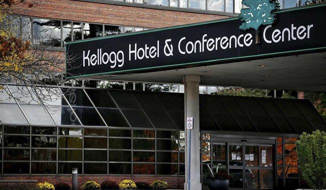 The Kellogg Hotel and Conference Center pictured on the Michigan State University campus, Friday, Oct. 16, 2020, in East Lansing, Mich. Any on-campus students not living in single-occupancy rooms with their own bathrooms are asked to self-isolate at Kellogg Center if they contract COVID-19 or have been exposed to someone who did. (Nick King/Lansing State Journal via AP)