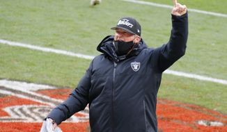 Las Vegas Raiders head coach Jon Gruden celebrates after the Raiders defeated the Cleveland Browns 16-6 in an NFL football game, Sunday, Nov. 1, 2020, in Cleveland. (AP Photo/Ron Schwane)