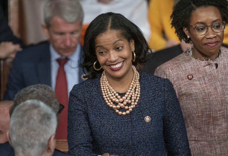 FILE - Rep. Jahana Hayes, D-Conn., center, smiles on the first day of the 116th Congress, Thursday, Jan. 3, 2019, on the Capitol in Washington. Hayes will face Republican David Sullivan for Connecticut's 5th Congressional District in the 2020 elections. (AP Photo/J. Scott Applewhite, File)