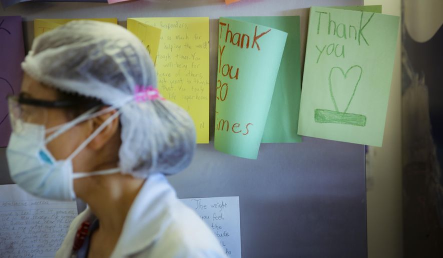 FILE - In this May 29, 2020, file photo, letters of thanks from students adorn the walls of a break room that was set up for workers to decompress from the stresses of caring for COVID-19 patients at Elmhurst Hospital, in New York. As the coronavirus pandemic surges across the nation and infections and hospitalizations rise, medical administrators are scrambling to find enough nursing help — especially in rural areas and at small hospitals. (AP Photo/Robert Bumsted, File)