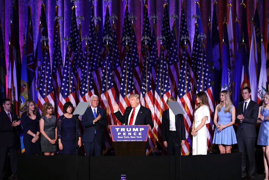 That was then: President-elect Trump acknowledges he won, flanked by running mate Mike Pence and surrounded by family on Nov. 9, 2016. (Associated Press)