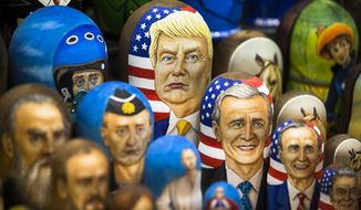 In this photo taken on Thursday, March 2, 2017, Matryoshkas, traditional Russian wooden dolls, including a doll of U.S. President Donald Trump, top, are displayed for sale in Moscow, Russia. From Moscow, the U.S. election looks like a contest between &quot;who dislikes Russia most,&quot; according to Kremlin spokesman Dmitry Peskov. Russian President Vladimir Putin is frustrated with President Donald Trump&#39;s failure to deliver on his promise to fix ties between the countries. But Democratic challenger Joe Biden does not offer the Kremlin much hope either. (AP Photo/Alexander Zemlianichenko, File)