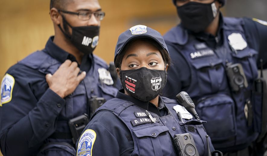 District of Columbia Metropolitan Police officers patrol outside the White House as demonstrators gather, Tuesday, Nov. 3, 2020, in Washington. (AP Photo/John Minchillo) **FILE**